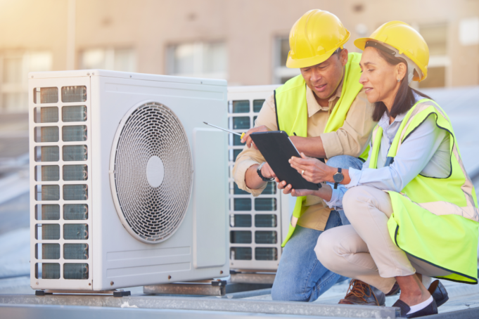 Facility team members implementing modern HVAC systems.