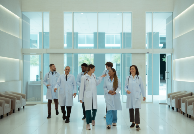 Doctors appreciating modern hospital design.