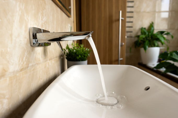 An image of a clean faucet representing hospital water management.